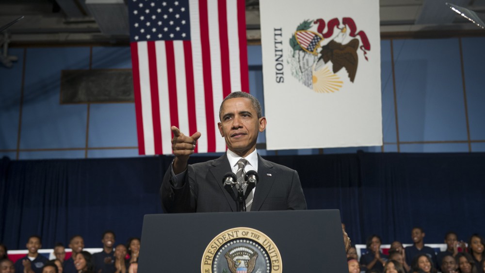 US President Barack Obama speaks about gun violence as well as the economy at Hyde Park Academy in Chicago on February 15, 2013.  (Photo by Saul Loeb/AFP/Getty Images)