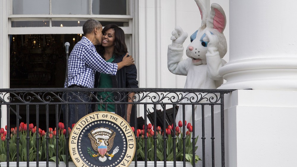 President Barack Obama kisses first lady Michelle Obama after they spoke to the crowd during the annual White House Easter Egg Roll on the South Lawn of the White House March 28, 2016 in Washington, D.C. (Photo by Drew Angerer/Getty)