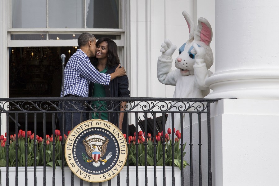 President Barack Obama kisses first lady Michelle Obama after they spoke to the crowd during the annual White House Easter Egg Roll on the South Lawn of the White House March 28, 2016 in Washington, D.C. (Photo by Drew Angerer/Getty)