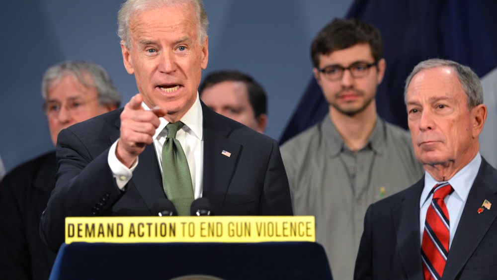 Vice President Joe Biden speaks with New York Mayor Michael Bloomberg as they join families from Newtown, Connecticut to discuss the need for federal gun laws March 21, 2013 at City Hall in New York. (Photo by Stan Honda/AFP/Getty Images)