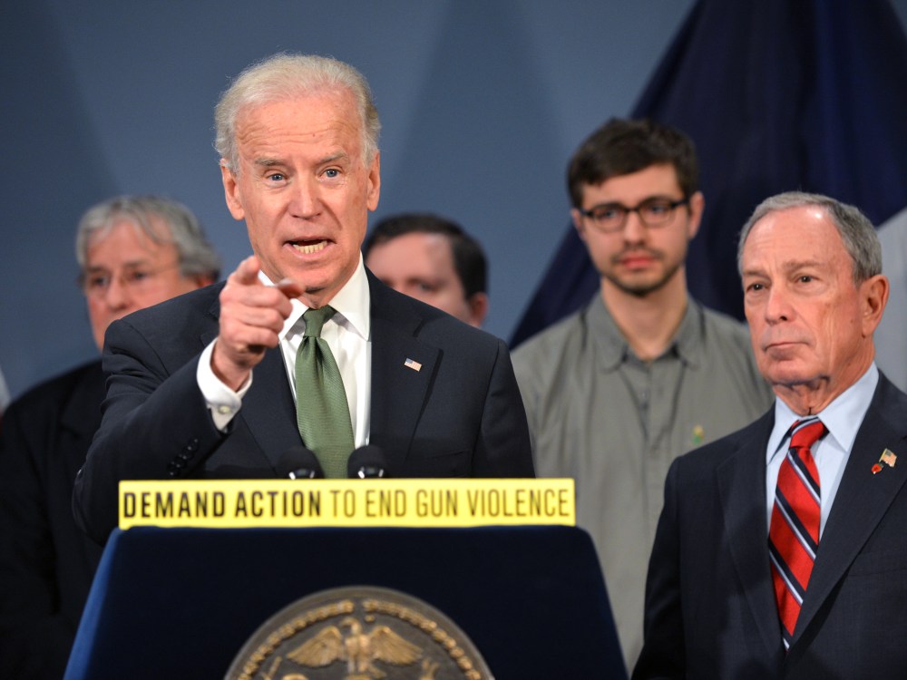 Vice President Joe Biden speaks with New York Mayor Michael Bloomberg as they join families from Newtown, Connecticut to discuss the need for federal gun laws March 21, 2013 at City Hall in New York. (Photo by Stan Honda/AFP/Getty Images)