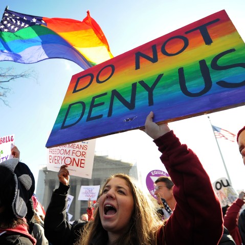 Same-sex marriage supporters shout slogans in front of the US Supreme Court on March 26, 2013 in Washington, DC. The US Supreme Court takes up the emotionally charged issue of gay marriage as it considers arguments that it should make history and...