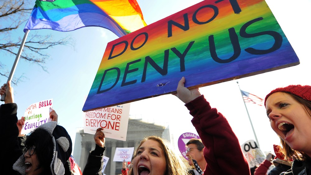 Same-sex marriage supporters shout slogans in front of the US Supreme Court on March 26, 2013 in Washington, DC. The US Supreme Court takes up the emotionally charged issue of gay marriage as it considers arguments that it should make history and...