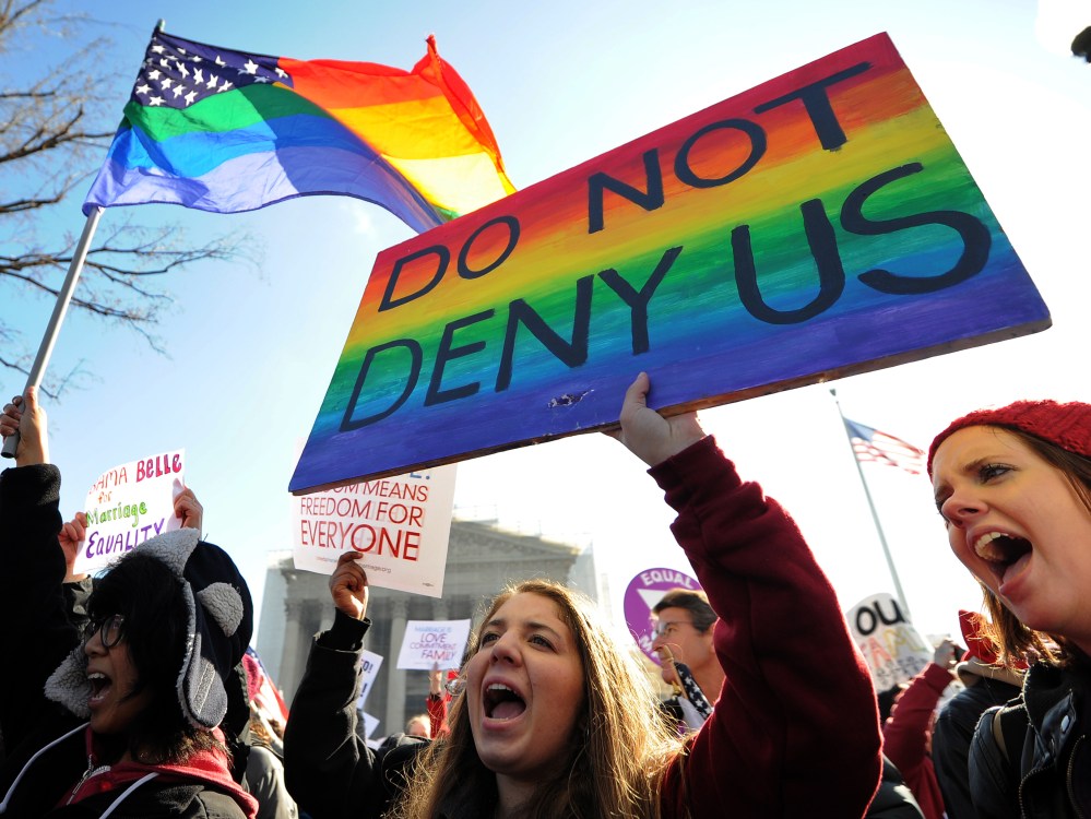 Same-sex marriage supporters shout slogans in front of the US Supreme Court on March 26, 2013 in Washington, DC. The US Supreme Court takes up the emotionally charged issue of gay marriage as it considers arguments that it should make history and...
