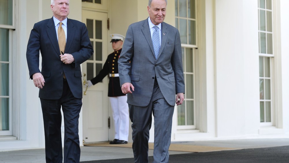 Senator Chuck Schumer (L), D-NY,  and Senator John McCain, R-AZ, make their way to speak to reporters outside of the West Wing following a meeting with US President Barack Obama to brief him on the draft of a bipartisan immigration reform bill at the...