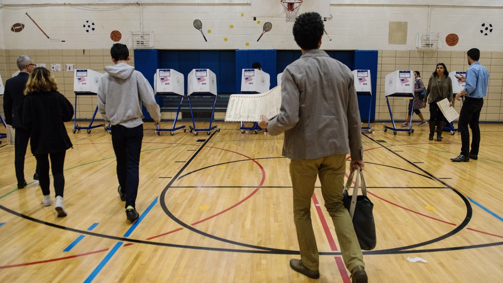 People vote at Public School 282 on April 19, 2016 in the Brooklyn borough of New York City. (Photo by Stephanie Keith/Getty)