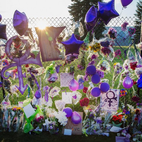 Mementos left by fans are attached to the fence which surrounds Paisley Park, the home and studio of Prince, on April 23, 2016 in Chanhassen, Minn. (Photo by Scott Olson/Getty)