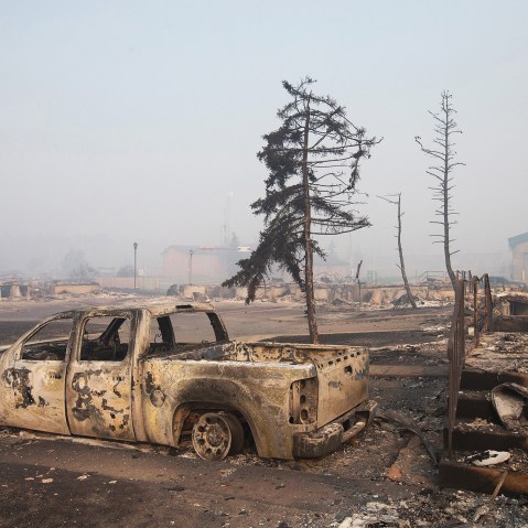 Home foundations and shells of vehicles are nearly all that remain in a residential neighborhood destroyed by a wildfire on May 6, 2016 in Fort McMurray, Alberta, Canada. (Photo by Scott Olson/Getty)