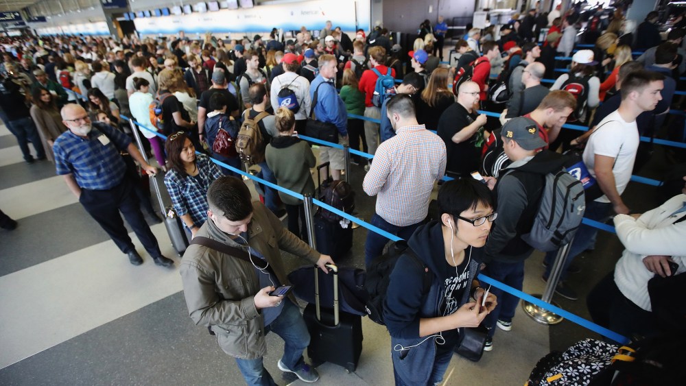 Passengers at O'Hare International Airport wait in line to be screened at a Transportation Security Administration (TSA) checkpoint on May 16, 2016 in Chicago, Ill. (Photo by Scott Olson/Getty)