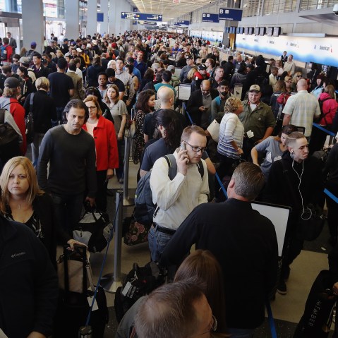 Passengers at O'Hare International Airport wait in line to be screened at a Transportation Security Administration (TSA) checkpoint on May 16, 2016 in Chicago, Ill. (Photo by Scott Olson/Getty)