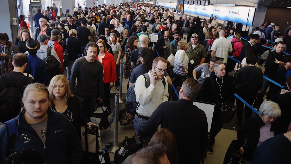 Passengers at O'Hare International Airport wait in line to be screened at a Transportation Security Administration (TSA) checkpoint on May 16, 2016 in Chicago, Ill. (Photo by Scott Olson/Getty)
