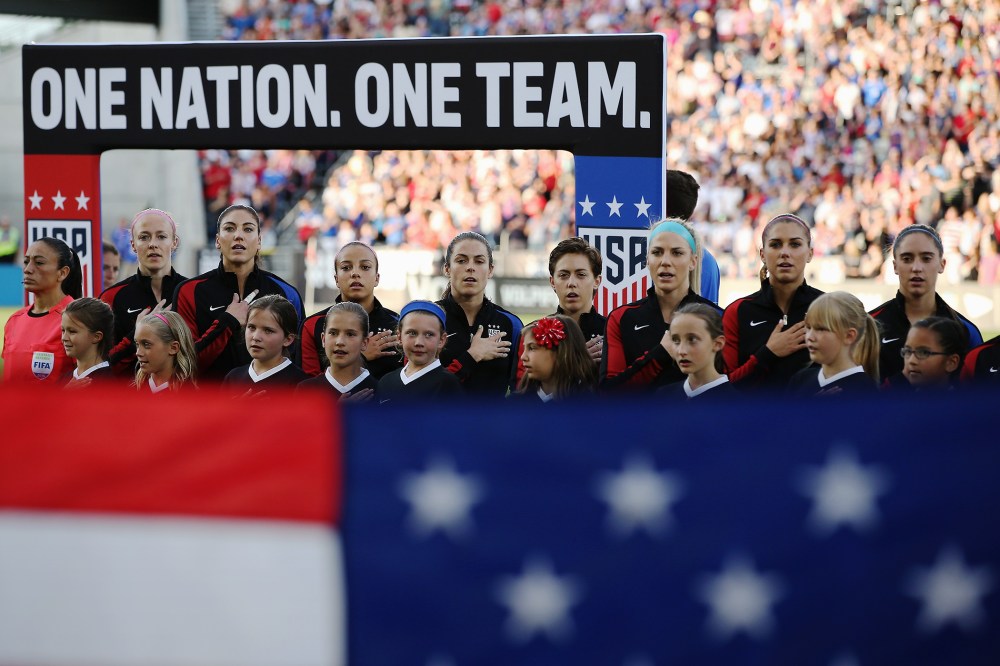 The United States Women's National Soccer Team observe the national anthem as they prepare to face Japan during an international friendly match at Dick's Sporting Goods Park on June 2, 2016 in Commerce City, Colo. (Photo by Doug Pensinger/Getty)