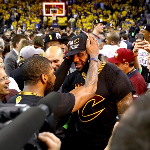 LeBron James #23 and Kyrie Irving #2 of the Cleveland Cavaliers celebrate after defeating the Golden State Warriors 93-89 in Game 7 of the 2016 NBA Finals at ORACLE Arena on June 19, 2016 in Oakland, Calif. (Photo by Ezra Shaw/Getty)