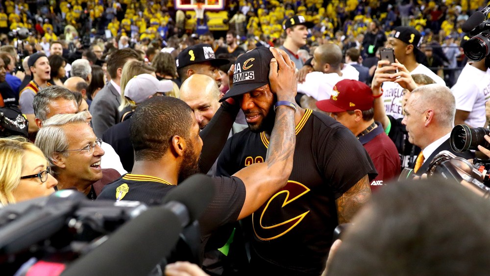LeBron James #23 and Kyrie Irving #2 of the Cleveland Cavaliers celebrate after defeating the Golden State Warriors 93-89 in Game 7 of the 2016 NBA Finals at ORACLE Arena on June 19, 2016 in Oakland, Calif. (Photo by Ezra Shaw/Getty)