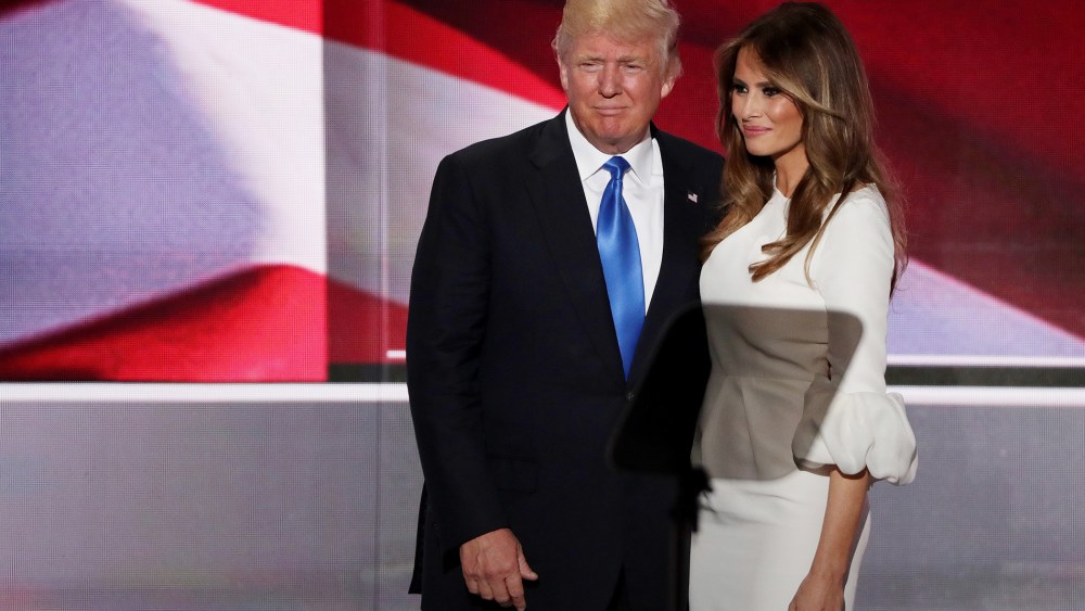 Donald Trump stands with his wife Melania after she delivered a speech on the first day of the Republican National Convention on July 18, 2016 at the Quicken Loans Arena in Cleveland, Ohio. (Photo by Alex Wong/Getty)