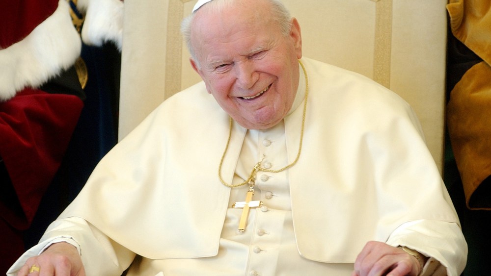 Pope John Paul II  breaks into a long laugh at the Vatican in this Feb. 17, 2004 file photo.