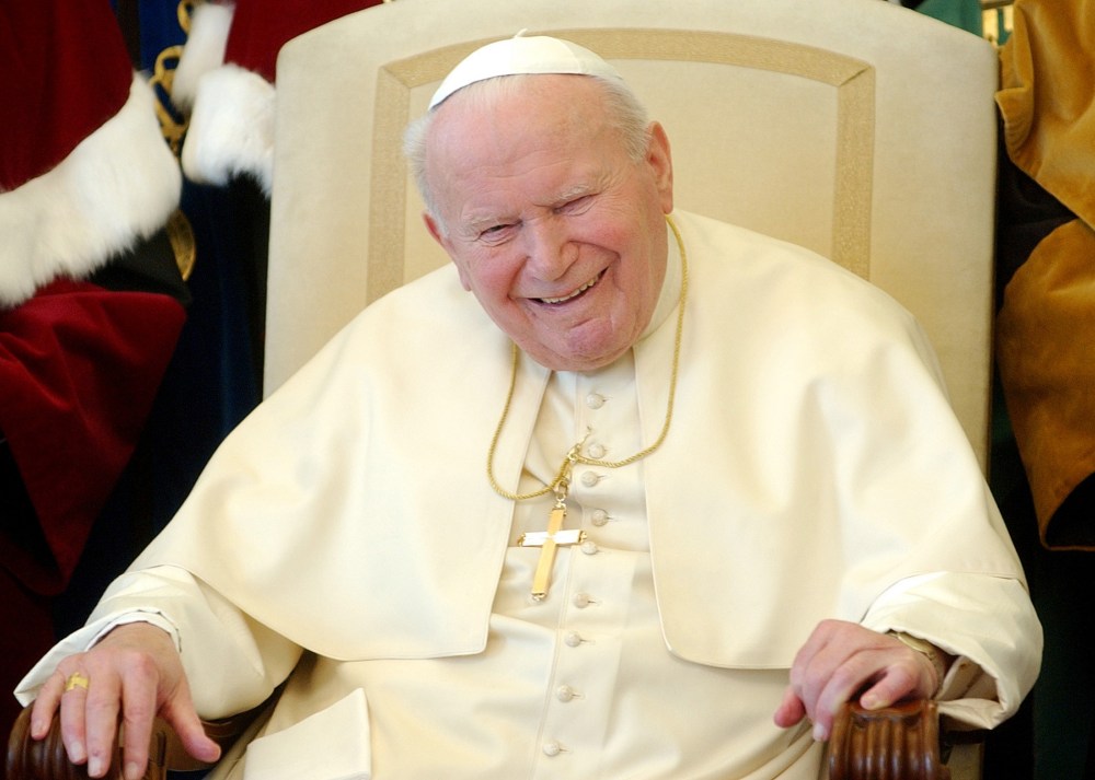 Pope John Paul II breaks into a long laugh at the Vatican in this Feb. 17, 2004 file photo.