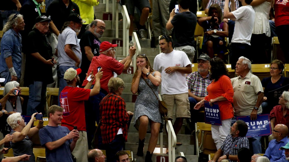 The crowd reacts as hecklers are escorted out during a speech by Republican presidential candidate Donald Trump at a rally on Sept. 12, 2016 at U.S. Cellular Center in Asheville, N.C. (Photo by Brian Blanco/Getty)