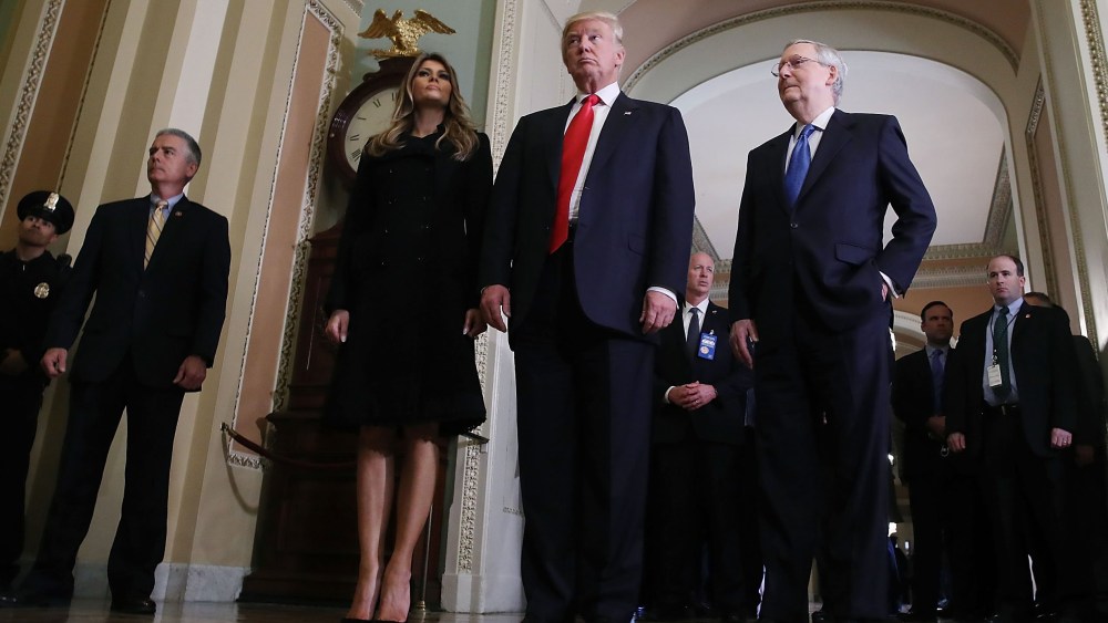 President-elect Donald Trump,  walks with his wife Melania Trump, and Senate Majority Leader Mitch McConnell after a meeting at the U.S. Capitol Nov. 10, 2016 in Washington, DC. (Photo by Mark Wilson/Getty)
