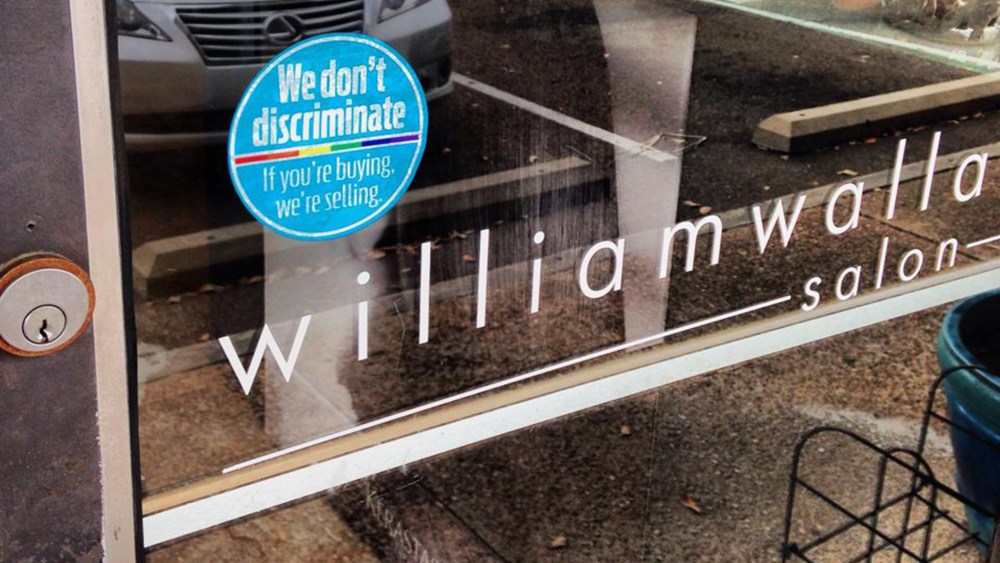 A sticker outside the Williams Wallace Salon in Jackson, Miss. promoting the "If You're Buying, We're Selling" campaign