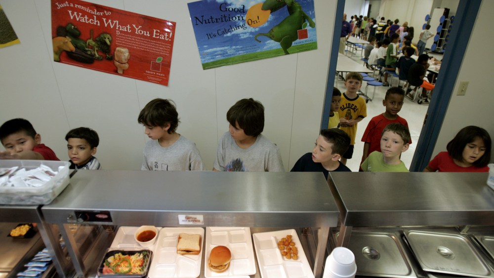 Children from McKamy Elementary School in Carrollton, Texas select food from the school cafeteria, Friday, Aug. 19, 2005.