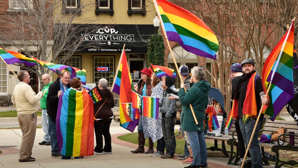 A group of same-sex marriage activists gathered outside the Madison County Courthouse to protest Judge Roy Moore's statements, Jan. 6, 2016, Ala. (Photo by Bob Gathany/AL.com/Landov)