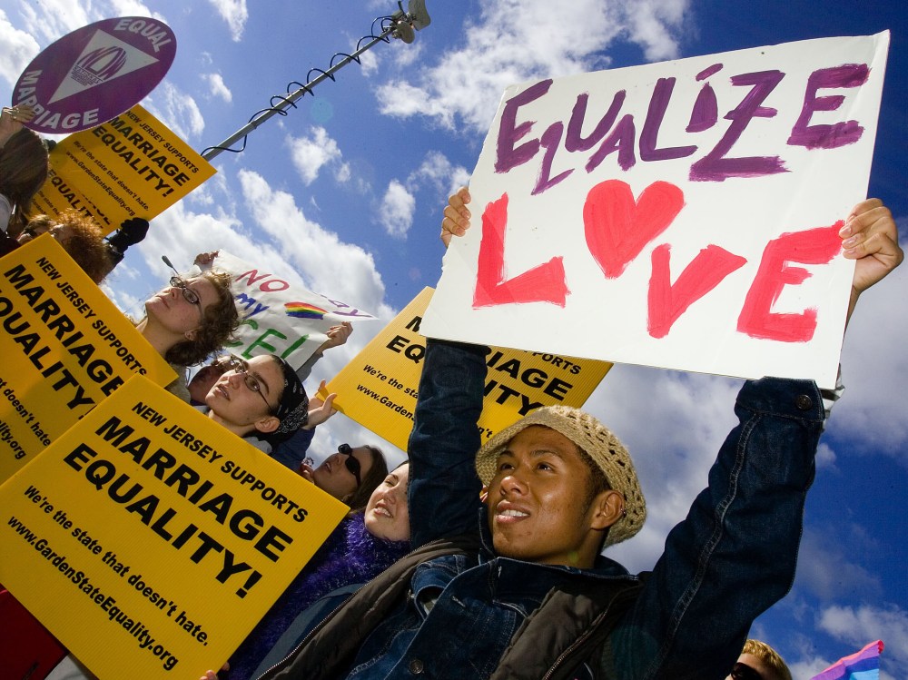 File Photo: Supporters await the New Jersey Supreme court decision on same-sex marriage in front of the Supreme court building on October 25, 2006 in Trenton, New Jersey. New Jersey's highest court guaranteed gay couples the same rights as married...