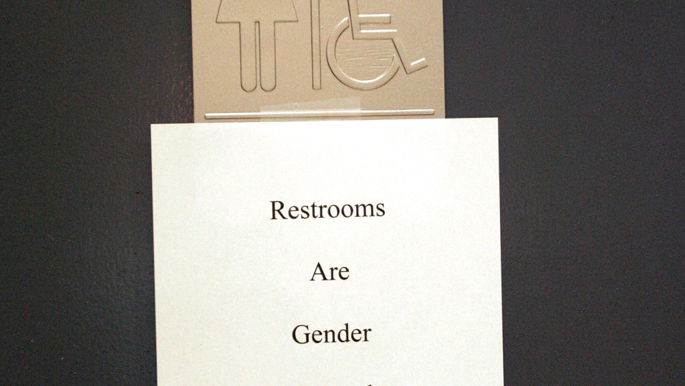 A sign is posted at the entrance of a restroom in n West Hollywood, CA.