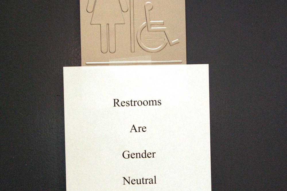 A sign is posted at the entrance of a restroom in n West Hollywood, CA.