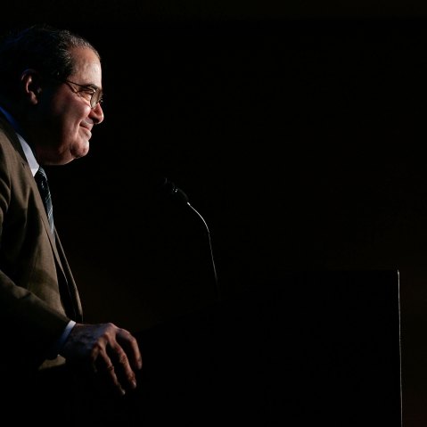 Late Supreme Court Associate Justice Antonin Scalia smiles as he addresses a Northern Virginia Technology Council (NVTC) breakfast Dec. 13, 2006 in McLean, Va. (Photo by Alex Wong/Getty)