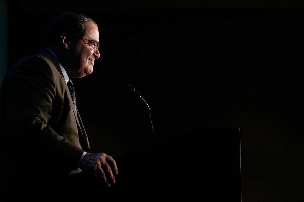 Late Supreme Court Associate Justice Antonin Scalia smiles as he addresses a Northern Virginia Technology Council (NVTC) breakfast Dec. 13, 2006 in McLean, Va. (Photo by Alex Wong/Getty)
