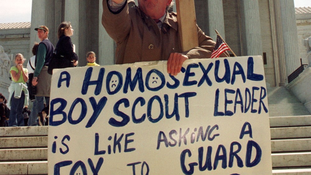 File Photo: Daniel Martino protests outside the Supreme Court as justices hear arguments in the case of New Jersey Boy Scout leader James Dale April 26, 2000 in Washington, DC. The Supreme Court heard arguments on whether the Boy Scouts have a...