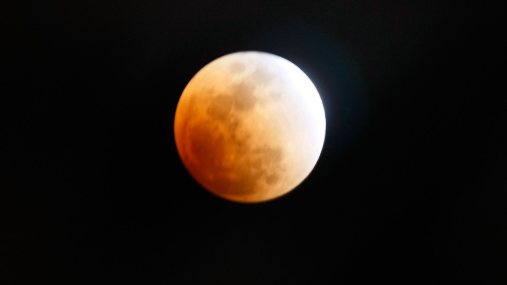 The moon is partly covered in the Earth's shadow during a phase of the lunar eclipse on Feb. 20, 2008 in Miami, Florida.