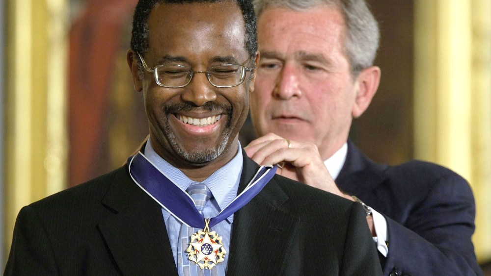 File Photo: U.S. President George W. Bush (R) presents a Presidential Medal of Freedom to Benjamin S. Carson, Sr. M.D (L), for his work with neurological disorders during an East Room ceremony June 19, 2008 at the White House in Washington, DC.  The...