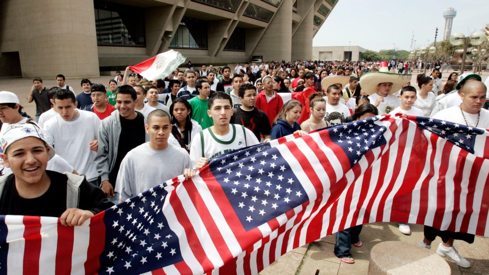 File Photo: Thousands of high school students march in front of city hall in Dallas, Tuesday, March 28, 2006. Thousands of students walked out of class and converged on City Hall to protest immigrant legislation in Congress.    (Photo by AP Photo/Tony...