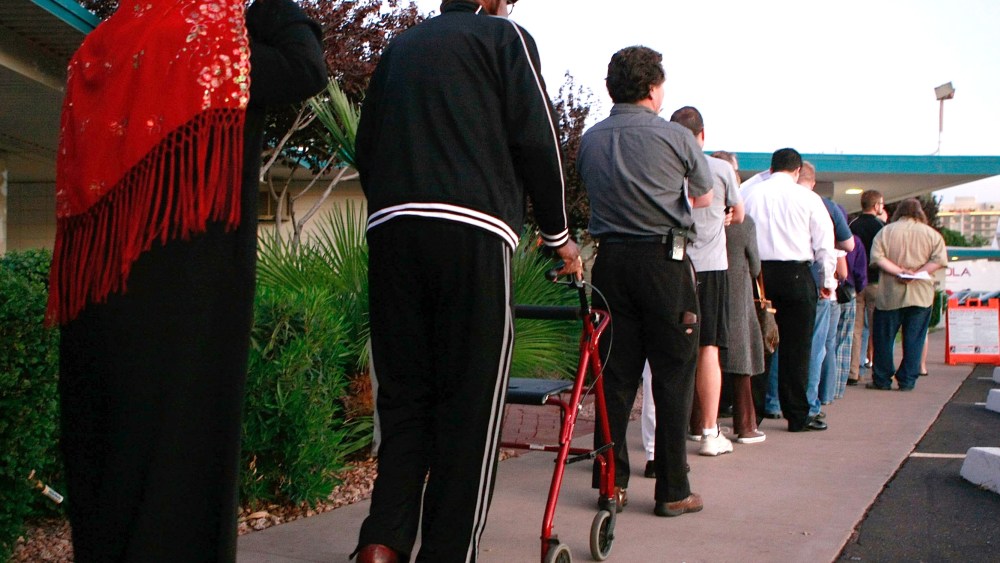 File Photo: People line up to vote at the Albright United Methodist Church November 4, 2008 in Phoenix, Arizona. (Photo by Mark Wilson/Getty Images, File)