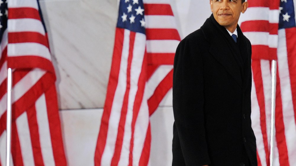 File Photo: US President-elect Barack Obama climbs up stairs to delivers his speech during the 'We Are One" concert, one of the events of Obama's inauguration celebrations, at the Lincoln Memorial in Washington on January 18, 2009. (Photo by  Jewel...
