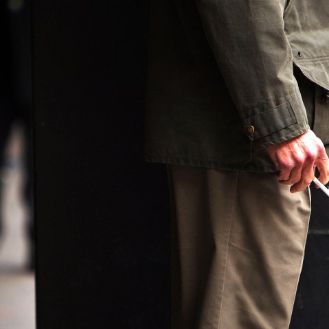 A man smokes a cigarette.
