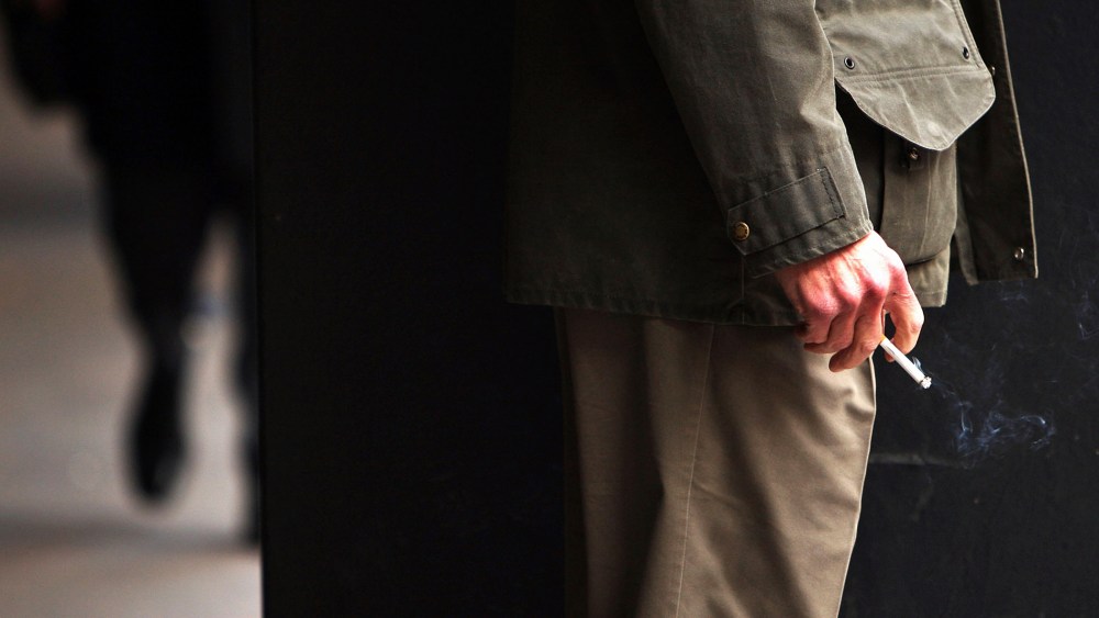 A man smokes a cigarette.