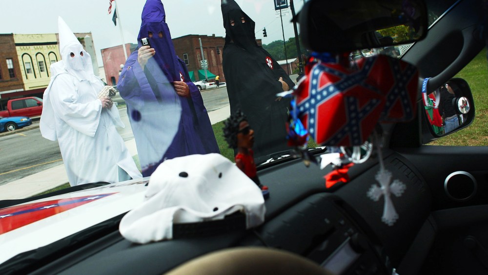 Members of the Fraternal White Knights of the Ku Klux Klan participate in the 11th Annual Nathan Bedford Forrest Birthday march July 11, 2009 in Pulaski, Tennessee.