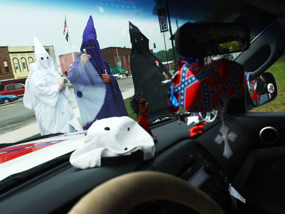 Members of the Fraternal White Knights of the Ku Klux Klan participate in the 11th Annual Nathan Bedford Forrest Birthday march July 11, 2009 in Pulaski, Tennessee.
