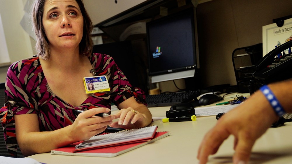 Speech therapist Heather Van Meter (L) of the VA Medical Center looks on as Iraq war veteran suffering from posttraumatic stress disorder (PTSD) Robert Wake describes his difficulties in concentrating and remembering during a counseling session at the...
