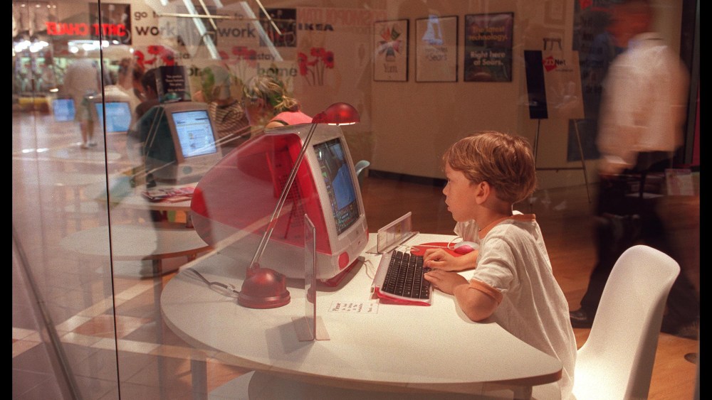 A young boy uses a computer at the Media Shopping center in Burbank, Calif. on Aug. 28, 1999. (Photo by Dan Callister/Hulton/Getty)