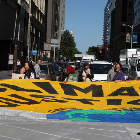 File Photo: Demonstrators block an intersection with a large banner as they protest the climate and energy bill that is currently before congress September 21, 2009 in San Francisco, California.(Photo by Justin Sullivan/Getty Images, File)