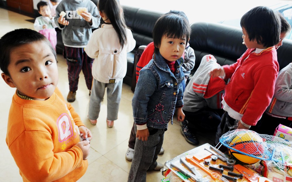 A group of 60 children are waiting to reunite with their parents after police rescued them from human traffickers at Guiyang Welfare Center for Children in Guiyang, southwest China's Guizhou province on October 29, 2009.