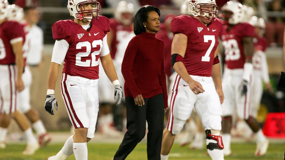 Honorary Stanford captain Condoleezza Rice walks to the middle of the field for the coin toss before their game against at Stanford Stadium on Nov. 28, 2009 in Palo Alto, Calif.