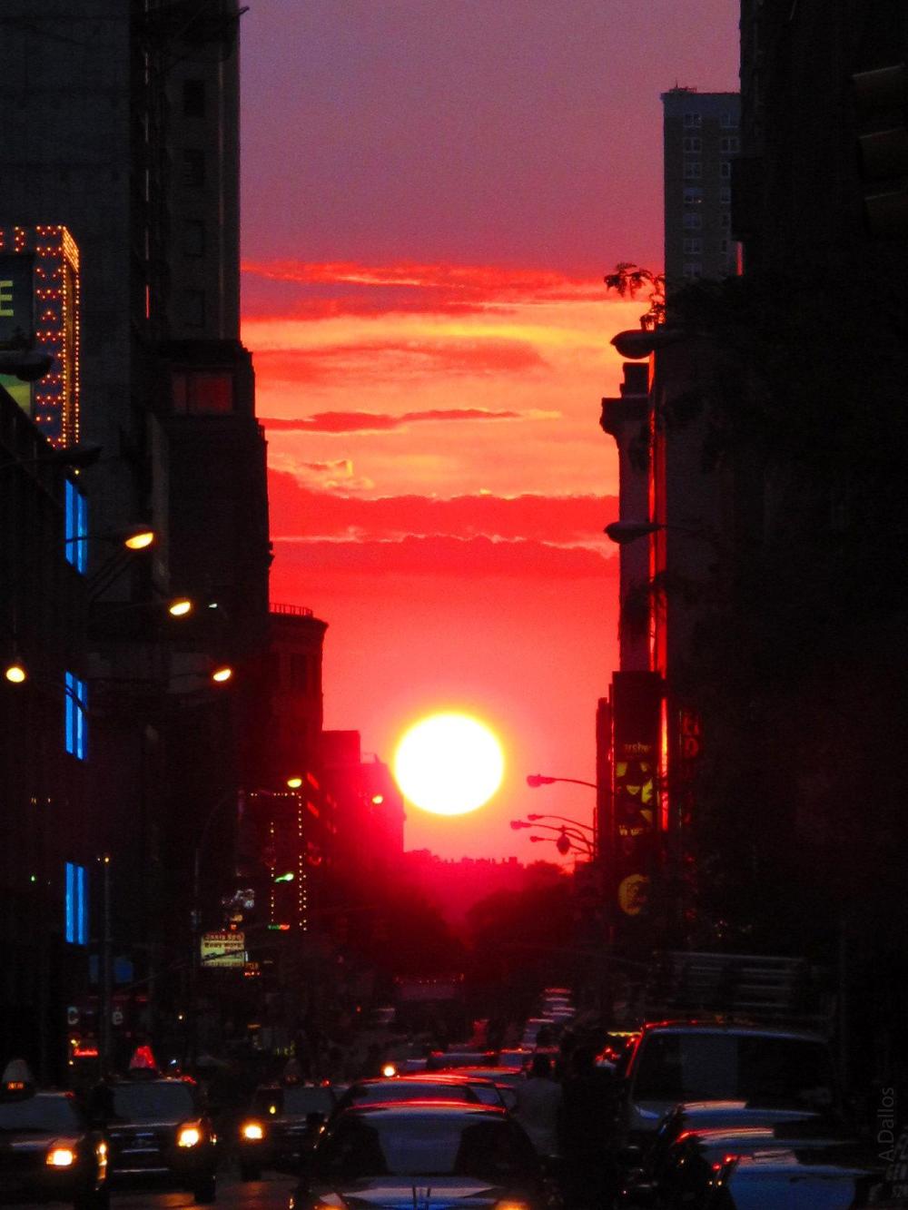 Clouds part for Manhattanhenge pilgrims