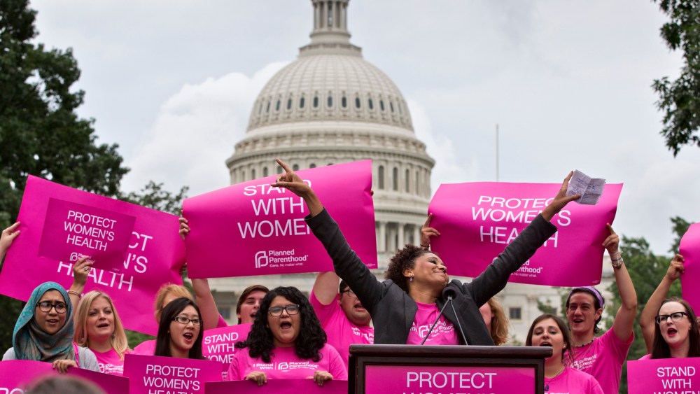 Women rally on Capitol Hill in Washington, Thursday, July 11, 2013.