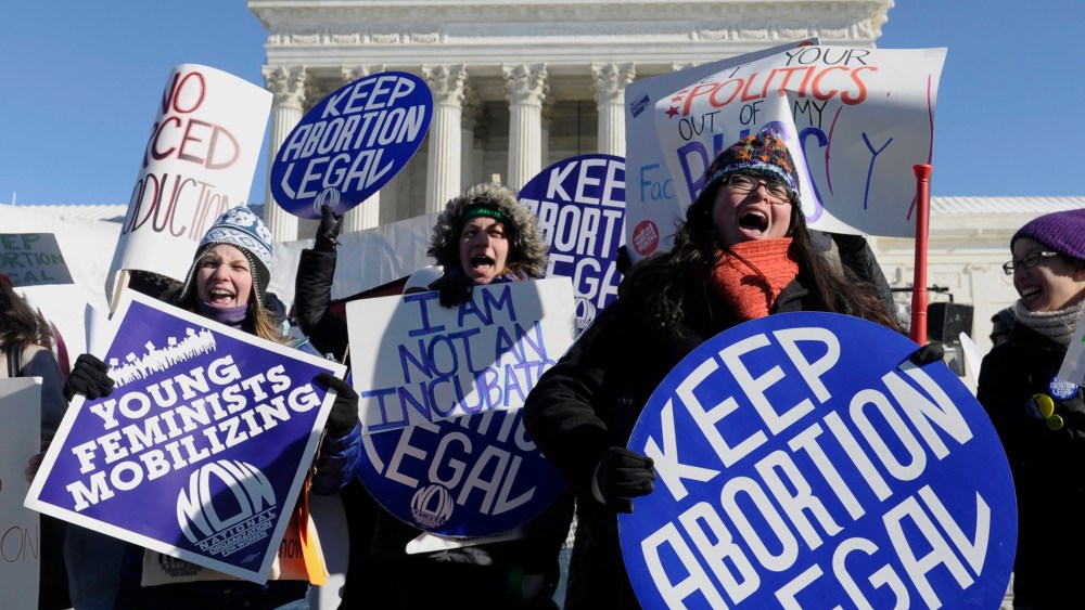 Pro-choice demonstrators rally outside the Supreme Court in Washington, Wednesday, January 22, 2014.