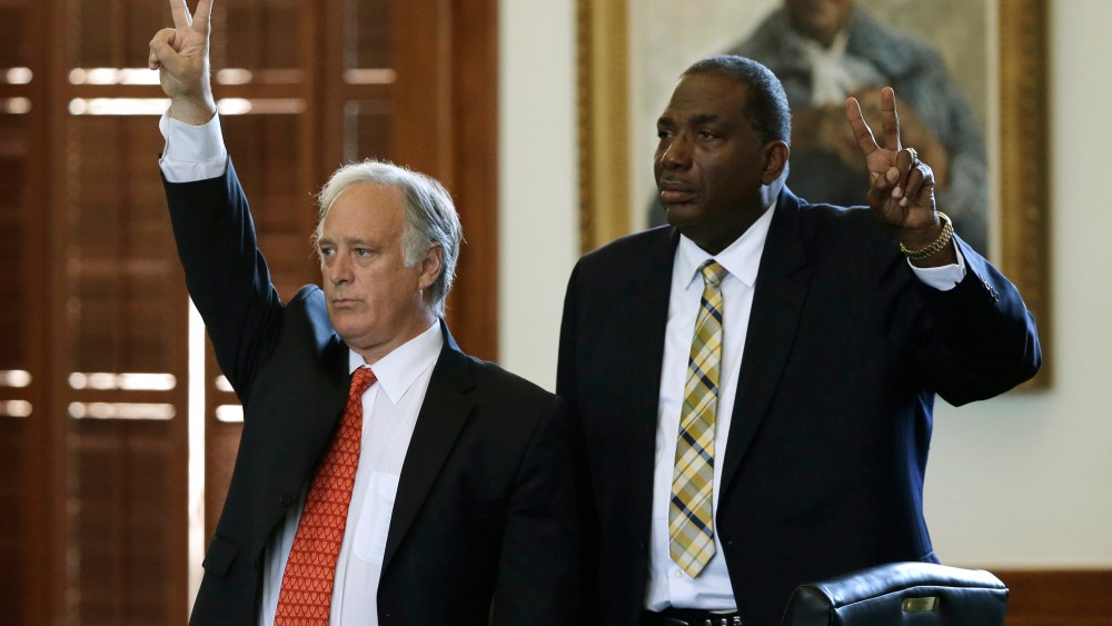 Sen. Kirk Watson, left, D-Austin, and Sen. Royce West, right, D-Dallas, vote against actions that would begin the debate early on legislation sent over by the house, Monday, June 24, 2013, in Austin, Texas. The Republican-dominated Texas Legislature...